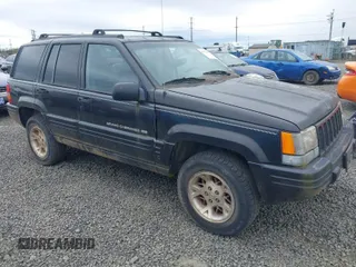 1998 Jeep Grand Cherokee Limited with VIN 1J4GZ78YXWC141912, listed as a IAAI auction lot 41972948 with 291,801 mi miles. Bid and sale history available at carsss.com. Image 1.