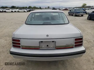1992 Oldsmobile Cutlass z VIN 1G3AL54N7N6363365, wystawiony jako Copart lot #76144254 z przebiegiem 52 896 mil mil oraz Tytuł czysty. Historia ofert i sprzedaży dostępna na DreamBid. Obrazek 6.