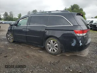 2014 Honda Odyssey Touring with VIN 5FNRL5H95EB056118, listed as a Copart auction lot 57729865 with Not provided miles and Salvage title. Bid and sale history available at DreamBid. Image 2.