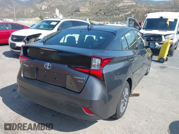 2021 Toyota Prius L Eco with VIN JTDKAMFU4M3144985, listed as a IAAI auction lot 42443957 with 20,816 mi miles and . Bid and sale history available at DreamBid. Image 4.