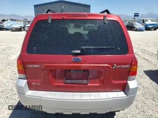 2007 Ford Escape Hybrid z VIN 1FMCU59H77KA61881, wystawiony jako Copart lot #64988665 z przebiegiem 242 536 mil mil oraz Czysty tytuł • Clean title. Historia ofert i sprzedaży dostępna na DreamBid. Obrazek 6.