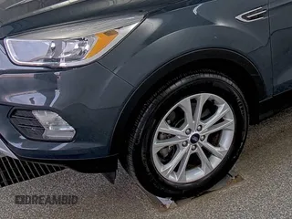 2019 Ford Escape SE z VIN 1FMCU9GD9KUA54757, wystawiony jako IAAI lot #42516631 z przebiegiem 87 040 mil mil oraz . Historia ofert i sprzedaży dostępna na DreamBid. Obrazek 14.