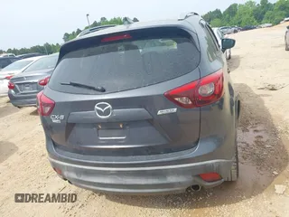 2016 Mazda CX-5 Grand Touring z VIN JM3KE2DY5G0801238, wystawiony jako IAAI lot #42264694 z przebiegiem 136 993 mil mil oraz . Historia ofert i sprzedaży dostępna na DreamBid. Obrazek 15.