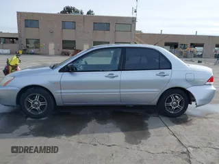 2004 Mitsubishi Lancer ES with VIN JA3AJ26E54U052124, listed as a IAAI auction lot 41804473 with 165,786 mi miles. Bid and sale history available at carsss.com. Image 15.