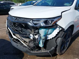 2021 Chevrolet Equinox Premier z VIN 2GNAXNEV9M6120241, wystawiony jako IAAI lot #42222928 z przebiegiem 104 274 mil mil oraz . Historia ofert i sprzedaży dostępna na DreamBid. Obrazek 6.
