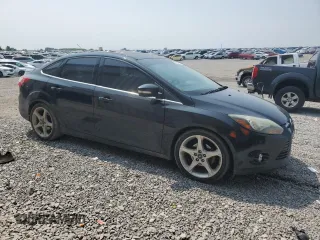 2014 Ford Focus Titanium with VIN 1FADP3J20EL347435, listed as a Copart auction lot 54947345 with 144,169 mi miles and Salvage title. Bid and sale history available at DreamBid. Image 4.