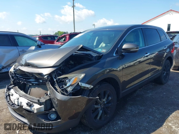 2015 Mazda CX-9 Grand Touring z VIN JM3TB3DV8F0465155, wystawiony jako IAAI lot #42366636 z przebiegiem 125 407 mil mil oraz . Historia ofert i sprzedaży dostępna na DreamBid. Obrazek 6.