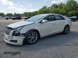 2013 Cadillac XTS Luxury with VIN 2G61P5S31D9228351, listed as a Copart auction lot 62119825 with 116,655 mi miles and Salvage title. Bid and sale history available at DreamBid. Image 1.