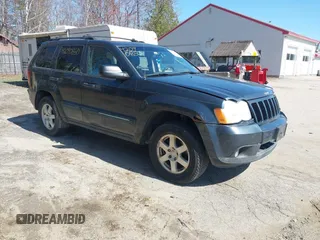 2008 Jeep Grand Cherokee Laredo with VIN 1J8GR48K98C161239, listed as a IAAI auction lot 42090850 with 218,063 mi miles. Bid and sale history available at carsss.com. Image 1.
