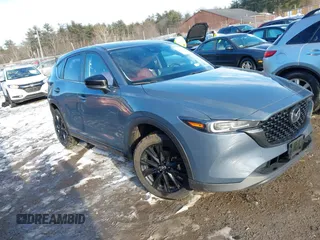 2023 Mazda CX-5 S Carbon Edition z VIN JM3KFBCM3P0219022, wystawiony jako IAAI lot #41460331 z przebiegiem 29 788 mil mil oraz . Historia ofert i sprzedaży dostępna na DreamBid. Obrazek 1.