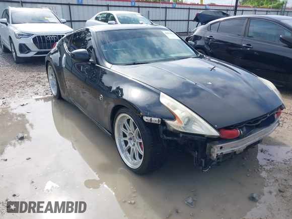 2013 Nissan 370Z with VIN JN1AZ4EH9DM880407, listed as a IAAI auction lot 42078526 with 216,029 mi miles. Bid and sale history available at carsss.com. Image 1.