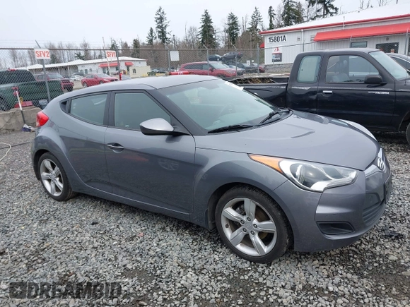 2012 Hyundai Veloster w/Gray Int z VIN KMHTC6AD7CU037130, wystawiony jako IAAI lot #41778588 z przebiegiem 125 549 mil mil oraz . Historia ofert i sprzedaży dostępna na DreamBid. Obrazek 13.