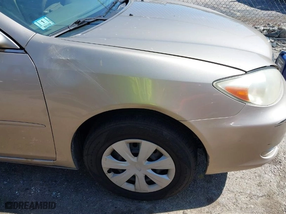 2004 Toyota Camry LE with VIN JTDBE32K740245605, listed as a IAAI auction lot 42068674 with 166,581 mi miles. Bid and sale history available at carsss.com. Image 6.