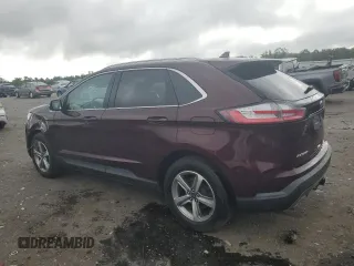 2019 Ford Edge SEL with VIN 2FMPK4J92KBB34891, listed as a Copart auction lot 60050945 with 104,942 mi miles and Salvage title. Bid and sale history available at DreamBid. Image 2.