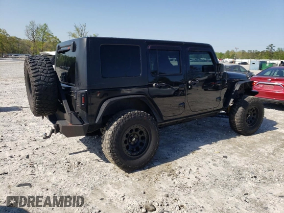 2013 Jeep Wrangler Unlimited Moab with VIN 1C4HJWEG7DL600043, listed as a Copart auction lot 52146945 with 118,882 mi miles and Salvage title. Bid and sale history available at DreamBid. Image 3.