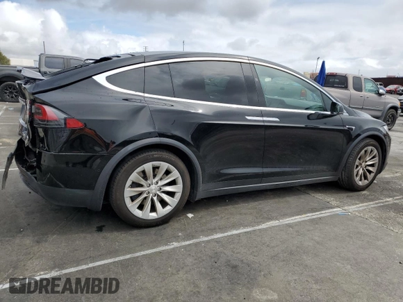 2018 Tesla Model X 75D with VIN 5YJXCBE24JF130216, listed as a Copart auction lot 48894215 with 75,694 mi miles and Salvage Title. Bid and sale history available at carsss.com. Image 3.