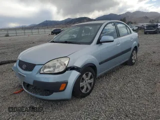 2009 Kia Rio LX with VIN KNADE223496469797, listed as a Copart auction lot 71005774 with 130,675 mi miles and Salvage Title. Bid and sale history available at carsss.com. Image 1.