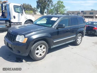 2010 Jeep Grand Cherokee Laredo with VIN 1J4PR4GK2AC104857, listed as a IAAI auction lot 42009569 with 131,986 mi miles. Bid and sale history available at carsss.com. Image 2.