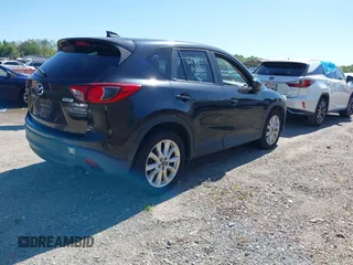 2013 Mazda CX-5 Grand Touring with VIN JM3KE4DE6D0127601, listed as a IAAI auction lot 42143558 with 95,719 mi miles and . Bid and sale history available at DreamBid. Image 4.