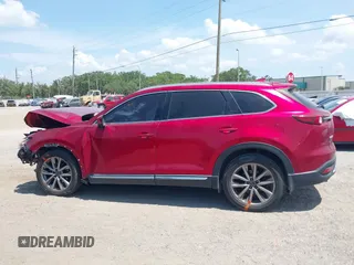 2019 Mazda CX-9 Grand Touring z VIN JM3TCADY5K0302436, wystawiony jako IAAI lot #42323545 z przebiegiem Nie podano mil oraz . Historia ofert i sprzedaży dostępna na DreamBid. Obrazek 14.