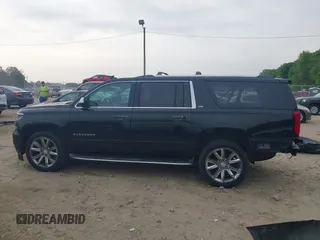 2015 Chevrolet Suburban LTZ with VIN 1GNSCKKCXFR731873, listed as a IAAI auction lot 42069917 with 108,963 mi miles and . Bid and sale history available at DreamBid. Image 15.