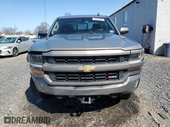 2017 Chevrolet Silverado 1500 LT with VIN 3GCUKREC0HG335785, listed as a Copart auction lot 51456305 with 104,614 mi miles and Salvage Title. Bid and sale history available at DreamBid. Image 5.