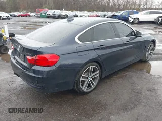 2016 BMW 4 Series 428i xDrive with VIN WBA4C9C59GG137067, listed as a IAAI auction lot 41913733 with 104,378 mi miles and . Bid and sale history available at carsss.com. Image 4.