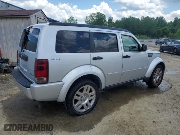 2011 Dodge Nitro Heat with VIN 1D4PU4GK0BW604975, listed as a Copart auction lot 56979275 with 160,494 mi miles and Salvage title. Bid and sale history available at DreamBid. Image 3.