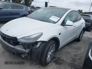 2023 Tesla Model Y Long Range z VIN 7SAYGDEE9PF623285, wystawiony jako IAAI lot #41383184 z przebiegiem 34 092 mil mil oraz . Historia ofert i sprzedaży dostępna na DreamBid. Obrazek 19.