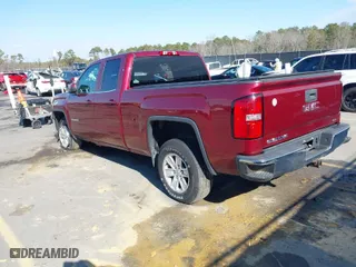 2014 GMC Sierra 1500 SLE with VIN 1GTV2UEH3EZ295586, listed as a IAAI auction lot 41399287 with 124,973 mi miles. Bid and sale history available at carsss.com. Image 3.
