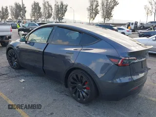 2023 Tesla Model Y Performance with VIN 7SAYGDEF6PF837174, listed as a IAAI auction lot 41436629 with 22,799 mi miles and . Bid and sale history available at DreamBid. Image 3.
