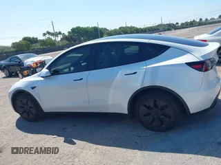 2024 Tesla Model Y with VIN 7SAYGDED9RF161420, listed as a IAAI auction lot 41892788 with 12,353 mi miles and . Bid and sale history available at DreamBid. Image 14.