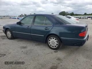 1997 Mercedes-Benz E-Class with VIN WDBJF55F4VJ025769, listed as a Copart auction lot 73460164 with 0 mi miles and Salvage Title. Bid and sale history available at carsss.com. Image 2.