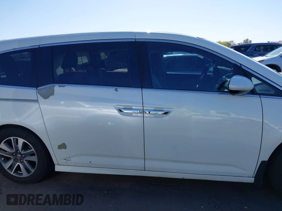 2014 Honda Odyssey Touring with VIN 5FNRL5H97EB037361, listed as a IAAI auction lot 42106742 with 198,279 mi miles and . Bid and sale history available at DreamBid. Image 13.