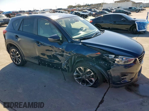 2016 Mazda CX-5 Grand Touring with VIN JM3KE2DY6G0668313, listed as a Copart auction lot 48353535 with 70,085 mi miles and Salvage Title. Bid and sale history available at carsss.com. Image 4.