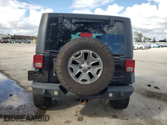 2016 Jeep Wrangler Rubicon with VIN 1C4BJWCG3GL162649, listed as a Copart auction lot 86327414 with 131,407 mi miles and Salvage title. Bid and sale history available at DreamBid. Image 6.