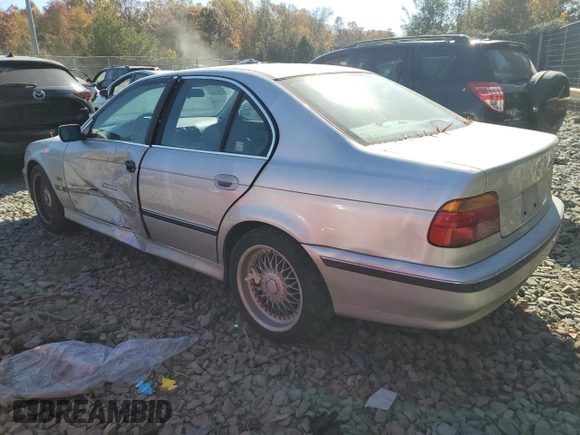 2000 BMW 5 Series 528iA with VIN WBADM6344YGU10582, listed as a Copart auction lot 77468634 with 0 mi miles and Salvage Title. Bid and sale history available at carsss.com. Image 2.