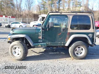 2000 Jeep Wrangler Sahara with VIN 1J4FA59S0YP724521, listed as a IAAI auction lot 41574689 with 167,584 mi miles. Bid and sale history available at carsss.com. Image 14.
