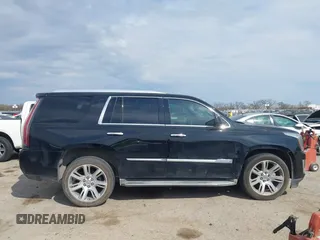 2015 Cadillac Escalade Luxury z VIN 1GYS4BKJ2FR260848, wystawiony jako IAAI lot #41895938 z przebiegiem 157 531 mil mil oraz . Historia ofert i sprzedaży dostępna na DreamBid. Obrazek 13.