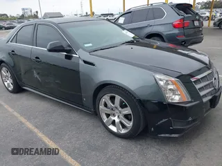2011 Cadillac CTS Luxury with VIN 1G6DF5EYXB0103430, listed as a IAAI auction lot 42105337 with 205,069 mi miles and . Bid and sale history available at DreamBid. Image 1.