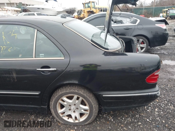 2002 Mercedes-Benz E-Class with VIN WDBJF82J52X064244, listed as a IAAI auction lot 41819863 with 999,999 mi miles. Bid and sale history available at carsss.com. Image 6.