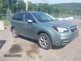 2017 Subaru Forester Touring with VIN JF2SJAWC8HH579492, listed as a IAAI auction lot 42571986 with 57,228 mi miles and . Bid and sale history available at DreamBid. Image 1.