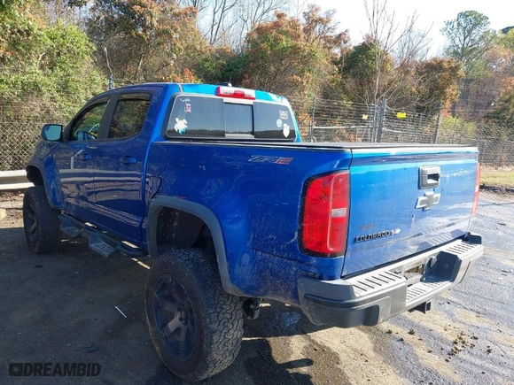 2019 Chevrolet Colorado 4WD ZR2 with VIN 1GCGTEEN5K1279370, listed as a IAAI auction lot 41879724 with 99,012 mi miles. Bid and sale history available at carsss.com. Image 3.