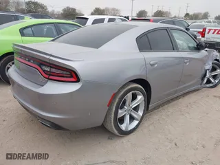 2018 Dodge Charger R/T with VIN 2C3CDXCTXJH148030, listed as a IAAI auction lot 41225873 with 105,069 mi miles. Bid and sale history available at carsss.com. Image 4.