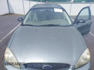 2005 Ford Taurus SE with VIN 1FAFP53U55A209369, listed as a IAAI auction lot 42144800 with 152,446 mi miles. Bid and sale history available at carsss.com. Image 6.