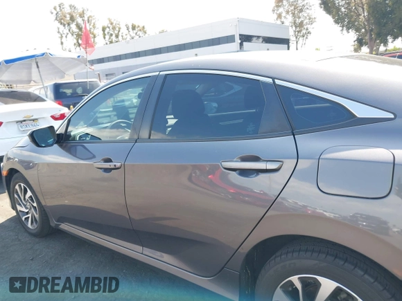 2016 Honda Civic EX with VIN 2HGFC2F74GH550780, listed as a IAAI auction lot 42135678 with 125,005 mi miles and . Bid and sale history available at DreamBid. Image 14.
