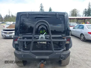 2014 Jeep Wrangler Unlimited Sahara with VIN 1C4BJWEG6EL107526, listed as a IAAI auction lot 42030244 with 69,077 mi miles. Bid and sale history available at carsss.com. Image 16.