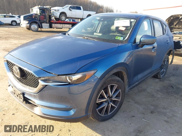 2018 Mazda CX-5 Touring z VIN JM3KFBCM2J0461954, wystawiony jako IAAI lot #41655865 z przebiegiem 129 333 mil mil oraz . Historia ofert i sprzedaży dostępna na DreamBid. Obrazek 19.