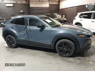 2022 Mazda CX-30 S Carbon Edition with VIN 3MVDMBCL8NM447234, listed as a IAAI auction lot 42511600 with 51,926 mi miles and . Bid and sale history available at DreamBid. Image 13.