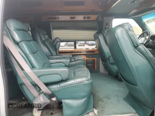 1999 Ford Econoline Cargo Recreational with VIN 1FDRE14L3XHA31771, listed as a Copart auction lot 49973795 with 220,268 mi miles and Salvage title. Bid and sale history available at DreamBid. Image 11.